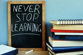 never stop learning written on blackboard